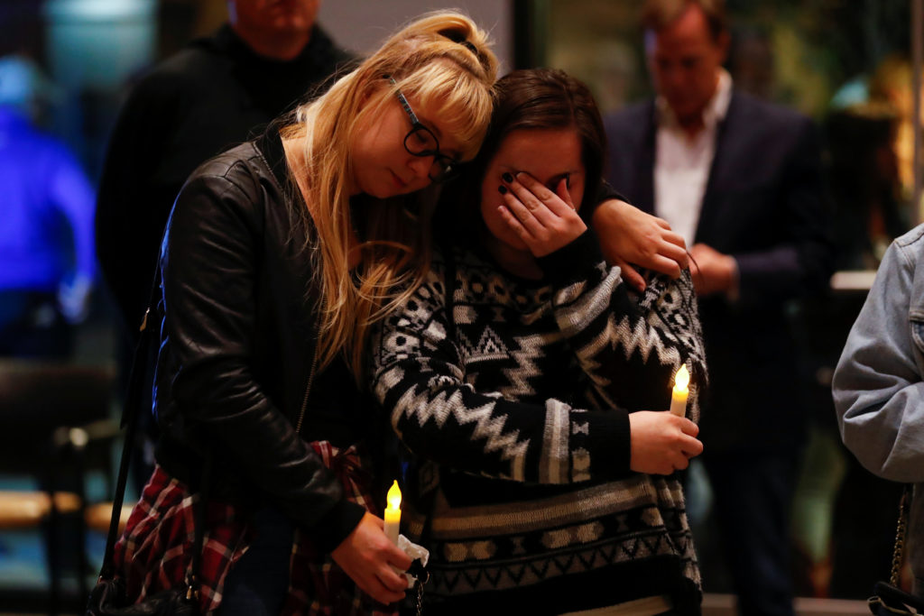 Mourners attend a vigil for the victims of the mass shooting, at the Thousand Oaks Civic Arts Plaza in Thousand Oaks, Cali...