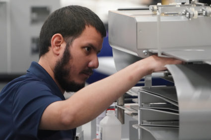 A worker cleans a ballot counting machine before a recount in Lauderhill, Florida, on Nov. 12. Photo by Carlo Allegri/Reuters