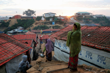 A Rohingya refugee woman holds her infant at the Balukhali camp in Cox's Bazar, Bangladesh, on Nov. 15. Photo by Mohammad Ponir Hossain/Reuters