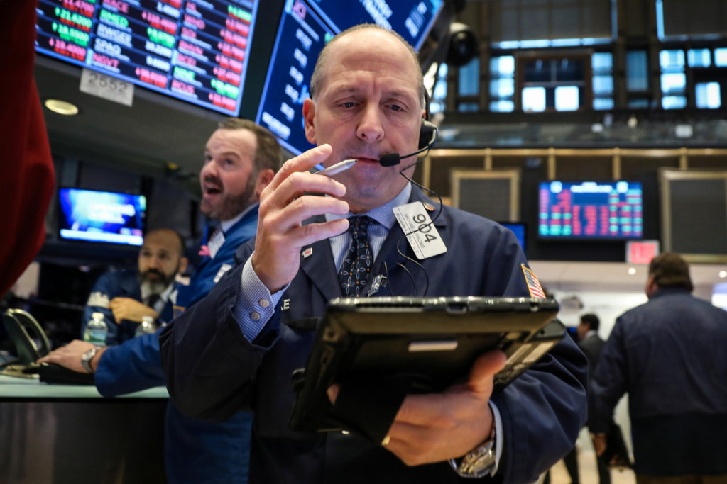 Traders work on the floor at the New York Stock Exchange in New York City. Photo by Brendan McDermid/Reuters