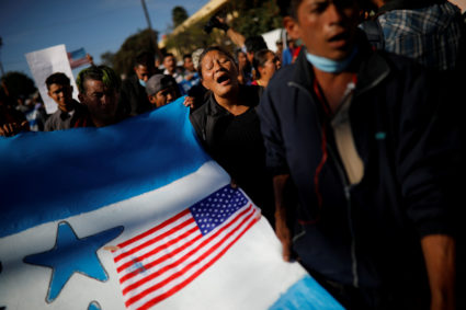 Migrants, part of a caravan of thousands traveling from Central America en route to the United States, take part in a protest march towards the border wall between the U.S. and Mexico, in Tijuana, Mexico. Photo by Alkis Konstantinidis/Reuters