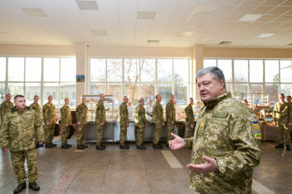 Ukraine's President Petro Poroshenko (R, front) addresses servicemen as he visits the 169th training centre "Desna" of the Ukrainian Army ground forces in Chernihiv Region, Ukraine. Photo by Mykola Lazarenko/Ukrainian Presidential Press Service via Reuters