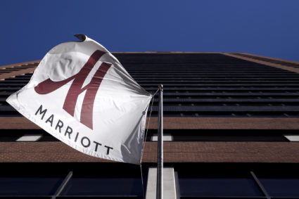 A Marriott flag hangs at the entrance of the New York Marriott Downtown hotel in Manhattan, New York November 16, 2015. REUTERS/Andrew Kelly/File Photo