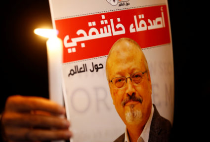 A demonstrator holds a poster with a picture of Saudi journalist Jamal Khashoggi outside the Saudi Arabia consulate in Istanbul, Turkey on Oct. 25, 2018. Photo by REUTERS/Osman Orsal