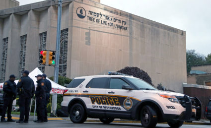 Police officers guard the Tree of Life synagogue following Saturday's shooting at the synagogue in Pittsburgh. Photo by Aaron Josefczyk/Reuters