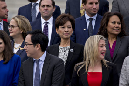 Young Kim, Republican U.S. Representative candidate from California, center, wait for a group photo with the 116th Congress outside the U.S Capitol in Washington, D.C., U.S., on Wednesday, Nov. 14, 2018. Congress returns to work this week with Democrats and Republicans promising to work together to avert a partial government shutdown and pass a handful of other bills, though President Donald Trumps demand to fund his border wall could blow up their plans. Photographer: Andrew Harrer/Bloomberg via Getty Images