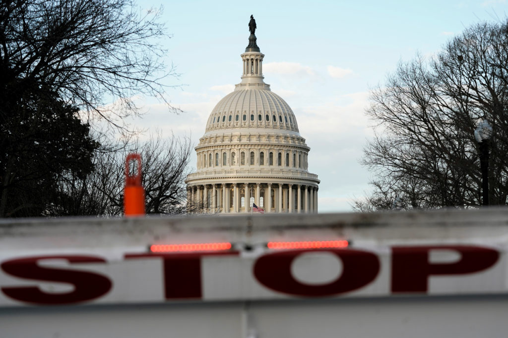A security barricade is placed in front of the U.S. Capitol on the first day of a partial federal government shutdown in W...