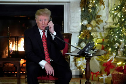 President Donald Trump participates in NORAD Santa tracker phone calls from the White House in Washington, D.C. Photo by Jonathan Ernst/Reuters
