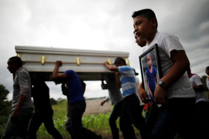 Friends and family carry a coffin with the remains of Jakelin Caal, a 7-year-old girl who handed herself in to U.S. border agents earlier this month and died after developing a high fever while in the custody of U.S. Customs and Border Protection, during her funeral at her home village of San Antonio Secortez, in Guatemala December 25, 2018. Photo by Carlos Barria/Reuters