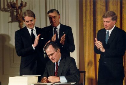 EPA Administrator William Reilly watches as President George H.W. Bush signs the Clean Air Act Amendments. Source: EPA