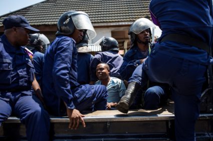 Congolese National Police arrest a man in Goma, on Dec. 27, 2018, during a demonstration against the postponement of the general elections in this area because of the Ebola outbreak. Photo by Patrick Meinhardt/AFP/Getty Images