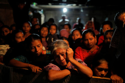 Elvira Choc, grandmother of Jakelin Caal, a 7-year-old girl who handed herself in to U.S. border agents earlier this month and died after developing a high fever while in the custody of U.S. Customs and Border Protection, reacts during a service at her home village of San Antonio Secortez, in Raxruha, Guatemala December 24, 2018. Photo by REUTERS/Carlos Barria