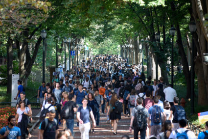 Students walk between classes on the Locust Walk on the campus of the University of Pennsylvania in Philadelphia. Photo by Charles Mostoller/Reuters