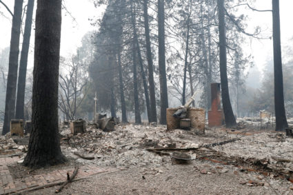 A house destroyed by the Camp Fire is seen in Paradise, California. Insurance claims have already topped $9 billion. Photo by Terray Sylvester/Reuters