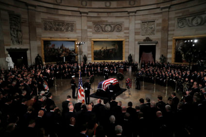 The casket carrying the remains of the late former President George H.W. Bush stands inside the U.S. Capitol rotunda during ceremonies in Washington D.C. Photo by Eric Thayer/Reuters