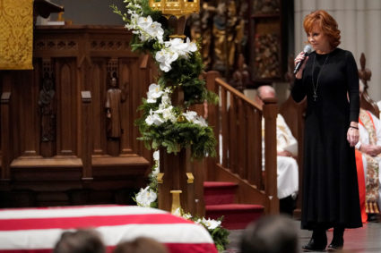 Reba McEntire sings "The Lord's Prayer" during a funeral service for former President George H.W. Bush at St. Martins Episcopal Church Thursday, Dec. 6, 2018, in Houston. Photo by David J. Phillip/Reuters