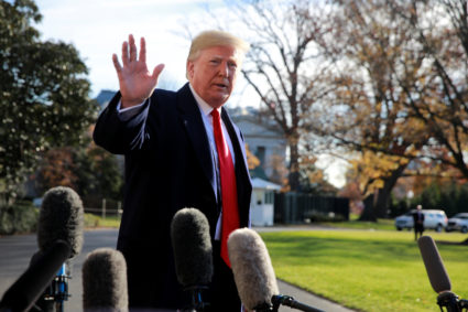 President Donald Trump waves to the press as he prepares to depart the South Lawn at the White House in Washington, D.C. Photo by Jim Young/Reuters