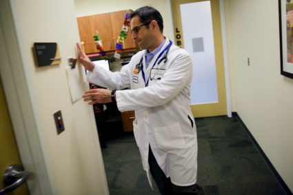 Dr. Mohammad Jaber prepares to visit a patient in Sacramento, California, November 17, 2015. Dr. Jaber immigrated from Syria to the United States to pursue a medical degree. REUTERS/Max Whittaker