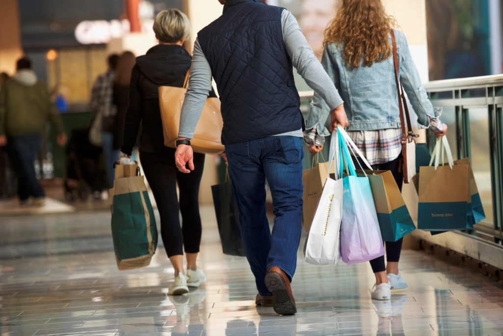 Shoppers carry bags of purchased merchandise at the United States' largest retail shopping space, in King of Prussia, Penn...