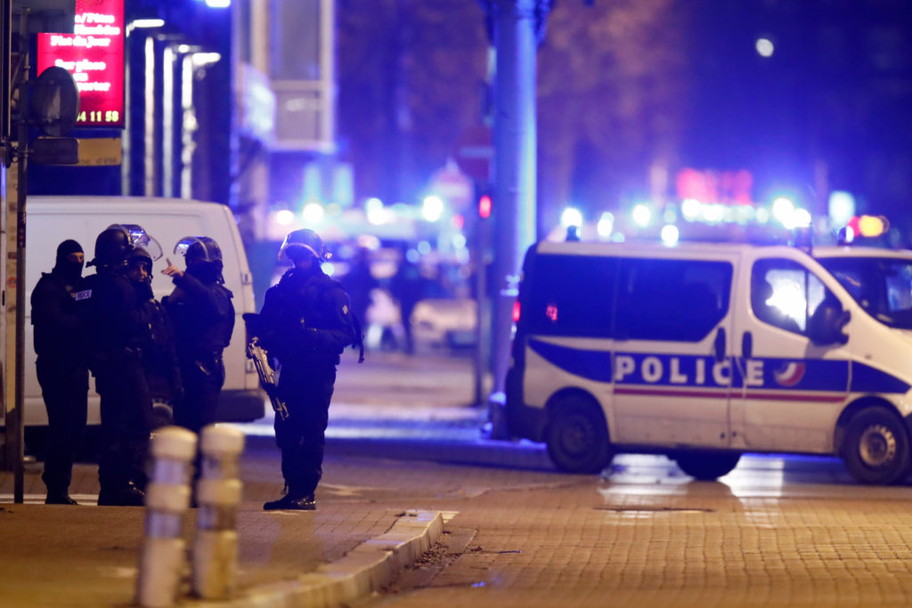 French special police forces secure an area during a police operation where the suspected gunman, Cherif Chekatt, who kill...