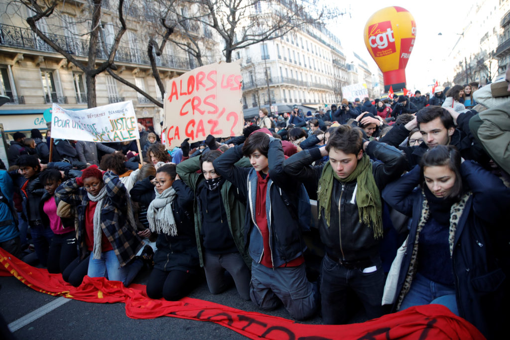 People attend a labour union demonstration to protest against the French government's reforms in Paris, France. The protes...