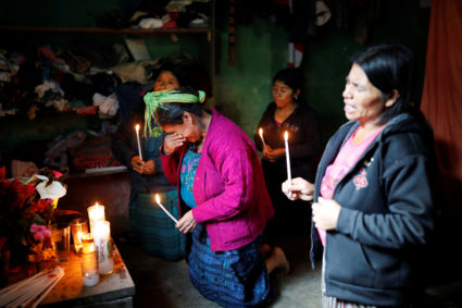 Catarina Perez (center), grandmother of Felipe Gomez Alonzo, a 8-year-old boy detained alongside his father for illegally entering the U.S., who fell ill and died in the custody of U.S. Customs and Border Protection, reacts while praying at an altar in memory of Felipe at the family's home in the village of Yalambojoch, Guatemala, on December 27, 2018. Luis Echeverria/Reuters