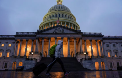 A pedestrian walk past the U.S. Capitol ahead of a possible partial government shut down in Washington, U.S., December 20, 2018. REUTERS/Joshua Roberts