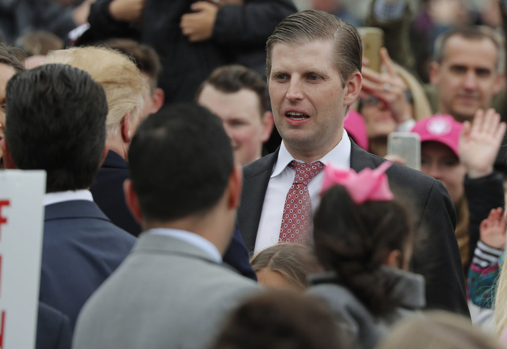 President Donald Trump's son Eric talks to his father as he attends the annual White House Easter Egg Roll on the South La...