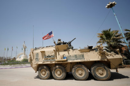 A U.S military vehicle travels in the town of Amuda, northern Syria April 29, 2017. Photo by Rodi Said/Reuters