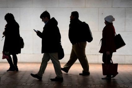 Commuters walk from the Federal Triangle Metro station after the U.S. government reopened with about 800,000 federal workers returning after a 35-day shutdown in Washington on Jan. 28, 2019. The shutdown caused an uptick in the unemployment rate for January. Photo by Joshua Roberts/Reuters
