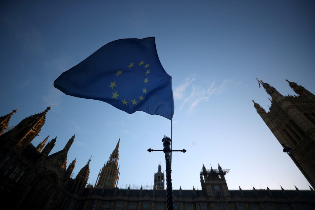 An EU flag flutters during an anti-Brexit demonstration outside the Houses of Parliament in London, Britain. Photo by Hann...
