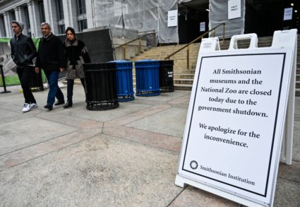 Tourists walk past a sign posted at the entrance of The National History Museum, stating that all Smithsonian Museums are closed due to the partial shutdown of the US government on January 2, 2019 in Washington, DC. - President Donald Trump warned Wednesday the US federal government may not fully reopen any time soon, as he stood firm on his demand for billions of dollars in funding for a border wall with Mexico. Addressing a cabinet meeting on the 12th day of the partial shutdown, Trump warned it "could be a long time" before the impasse is resolved. (Photo by Andrew Caballero-Reynolds / AFP) (Photo credit should read ANDREW CABALLERO-REYNOLDS/AFP/Getty Images)