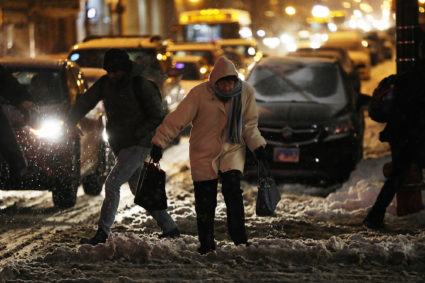 Pedestrians contend with snow and cold weather at Clinton Street and Jackson Boulevard in Chicago. Photo by Terrence Antonio James/Chicago Tribune/TNS via Getty Images