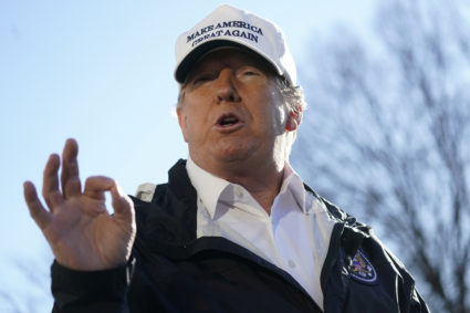 U.S. President Donald Trump talks to reporters as he departs for a visit to the U.S. southern border area in Texas from the White House. Photo by Carlos Barria/Reuters