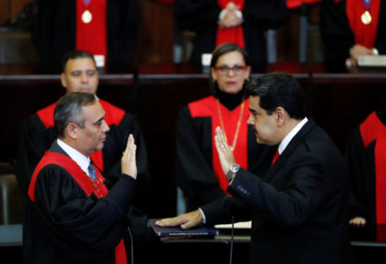 Venezuela's President Nicolas Maduro is sworn in by Venezuela's Supreme Court President Maikel Moreno, during the ceremonial swearing-in for his second presidential term, at the Supreme Court in Caracas, Venezuela on January 10, 2019. Photo by Carlos Garcia Rawlins/Reuters