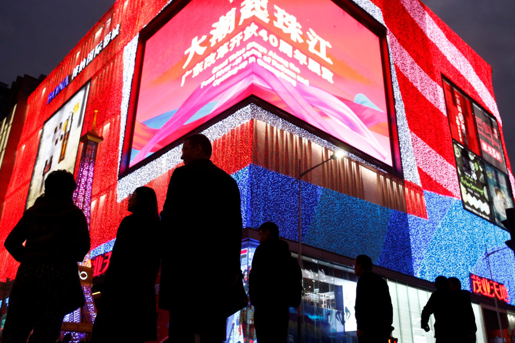People walk in Huaqiangbei Commercial Street, a shopping district for electronics and market place for Chinese producers a...