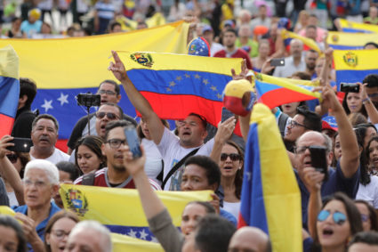 People attend a protest against Venezuela's President Nicolas Maduro's government at Plaza Bolivar in Lima, Peru. Photo by Guadalupe Pardo/Reuters