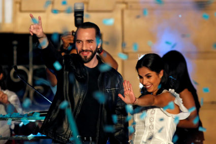 Presidential candidate Nayib Bukele of the Great National Alliance (GANA) and his wife Gabriela de Bukele gesture as they celebrate with supporters after the first official presidential election results were released in San Salvador, El Salvador. Photo by Jose Cabezas/Reuters