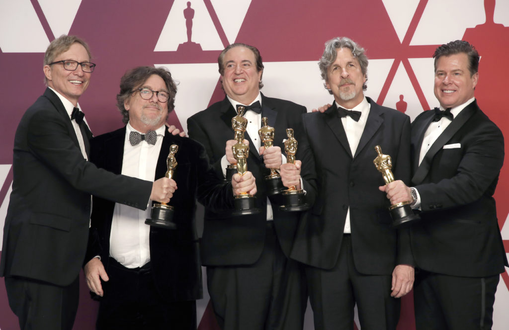 "Green Book" producers Jim Burke, Charles Wessler, Nick Vallelonga, Peter Farrelly and Brian Hayes Currie pose backstage w...