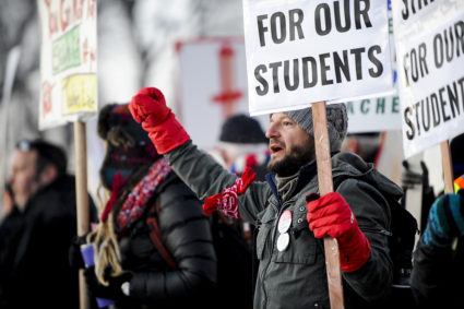 Denver high school social studies teacher Nick Childers chants as teachers picket outside South High School on Feb. 11, 2019, in Denver, Colorado. Denver teachers are striking for the first time in 25 years after the school district and the union representing the educators failed to reach an agreement after 14 months of contract negations over teacher pay. Photo by Michael Ciaglo/Getty Images