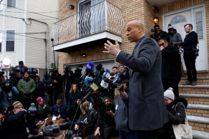 U.S. Senator Cory Booker (D-NJ) speaks to the media outside his home after announcing he will run for president in Newark, New Jersey, U.S., February 1, 2019. REUTERS/Andrew Kelly - RC16571830C0