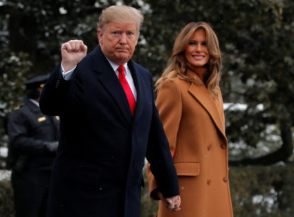 President Donald Trump walks with first lady Melania Trump while departing for Palm Beach, Florida from the White House on February 1, 2019. Photo by Jim Young/Reuters