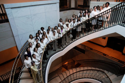 Speaker of the House Nancy Pelosi, D-Calif., stands with Democratic women House members during a photo-op recognizing suffragettes before the State of Union address on Capitol Hill. Photo by Joshua Roberts/Reuters