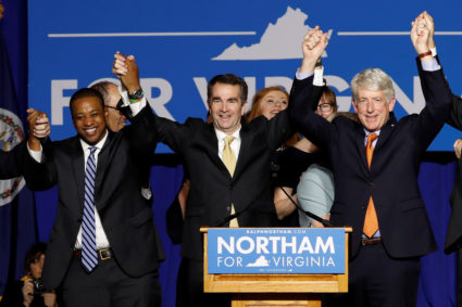 Virginia Governor Elect Ralph Northam (C) celebrates with Lt. Governor Elect Justin Fairfax and Attorney General Mark Herring at his election night rally on the campus of George Mason University in Fairfax, Virginia, November 7, 2017. Picture taken November 7, 2017. REUTERS/Aaron P. Bernstein - RC1EE26B6DD0