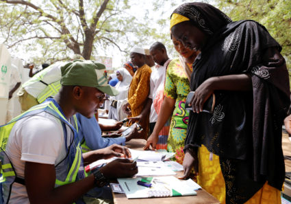 Nigerians cast ballots in delayed election after explosions, gunfire