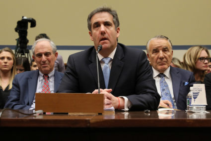 Michael Cohen, the former personal attorney of U.S. President Donald Trump, is flanked by his attorneys Lanny Davis (left) and Mike Monico (right) as he testifies before a House Committee on Oversight and Reform hearing on Capitol Hill on February 27, 2019. Photo by Jonathan Ernst/Reuters