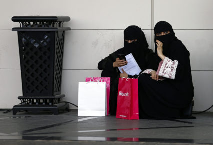Saudi student are seen at the exhibition to guide job seekers to the Glowork Women's Career Fair, in Riyadh, Saudi Arabia October 2, 2018. The Saudi government app Absher is used to pay traffic fines, but it also allows men to grant or deny a woman permission to travel. Photo by Faisal Al Nasser/Reuters.