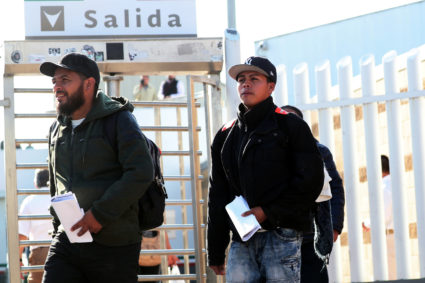Central American asylum seekers exit the Chaparral border crossing gate after being sent back to Mexico by the U.S. in Tijuana, Mexico. Photo by Shannon Stapleton/Reuters