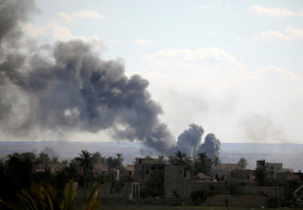 Black plumes of smoke rise in Baghouz, Deir Al Zor province, Syria March 3, 2019. Photo by Rodi Said/Reuters