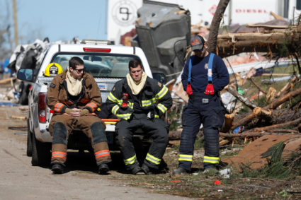 Members of the Auburn fire department are seen outside a devastated home after two deadly back-to-back tornadoes, in Beauregard, Alabama, U.S., March 5, 2019. Photo by Shannon Stapleton/Reuters